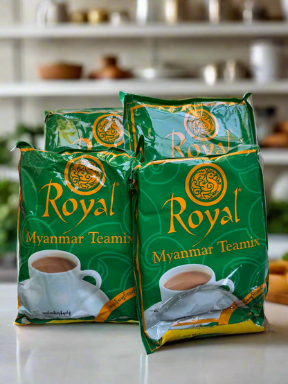 Three green packages of Royal Myanmar Teamix tea on a white surface.