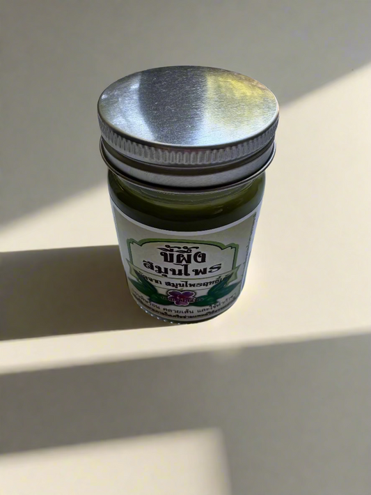 Small jar with a metal lid on a white surface